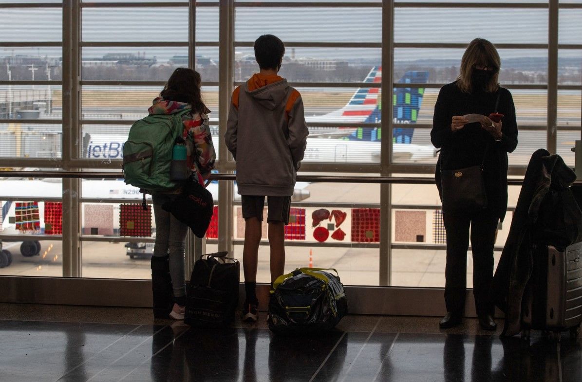 Holiday weekend flight cancellations highlight debate over new COVID rules