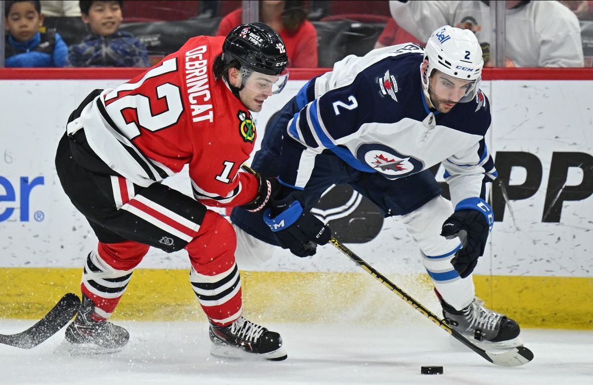 Jets' Harkins scores twice in 6-4 win over Blackhawks